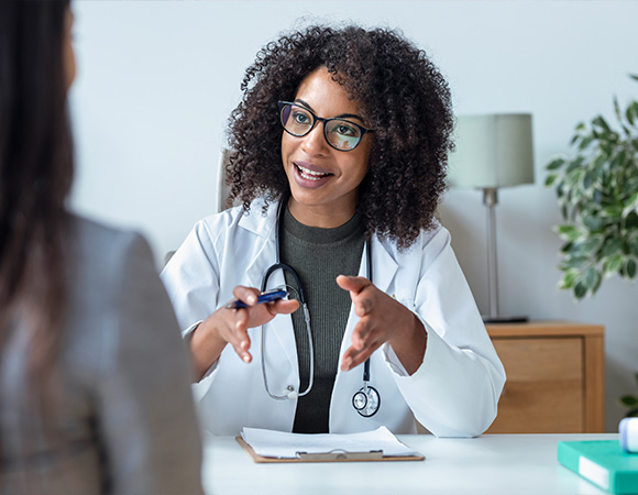 female doctor consulting with patient in modern office setting discussing health and wellness options 4 important tips
